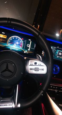 the steering wheel and dashboard of a car