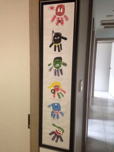 the door is decorated with handprints for children's names and pictures on it