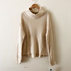 Gorgeous And Cozy Mock Neck Sweater By French Connection. Cream Color With A Slight Hint Of Yellow And Pretty Knit Detailing Along The Hems. Not A Cheap Acrylic Blend. Looks Like It Runs Quite Big, And There's Also A Generous Stretch To It. Would Probably Best Fit Those Who Wear L-Xl (Unless You're Into A Very Oversized Look, Which You Might Be!). Brand New With Tags, Never Worn Or Tried On. Measures 23" Armpit To Armpit 40% Viscose/21% Rayon/17% Wool Cool Water Wash Beige Ribbed Turtleneck Sweater, Beige Relaxed Fit Sweater For Winter, Winter White Chunky Knit Turtleneck, Neutral Knit Long Sleeve Tops, Neutral Knit Tops For Winter, Ribbed Neutral Top For Fall, Cozy Beige Tops For Winter, Cozy Beige Winter Tops, Neutral Knitted Winter Tops