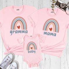 Rainbow Mama Baby Shirt, Gramma Tshirt, Mama and Mini Shirt, First Mothers Day Family Matching Shirt, Grandmother Shirt, Mommy and Me Shirt Celebrate motherhood in style with our Daisy Mama Mimi Mini Shirt! This adorable Mommy and Me Tshirt set is perfect for creating unforgettable moments on First Mothers Day. Made from soft, high-quality fabric, these shirts are not only comfortable but also stylish. The matching design is ideal for capturing precious family moments and announcing your pregnan Family Matching Multicolor Tops With Name Print, Pink Matching Top For Gender Reveal, Rainbow Cotton Top For Birthday, Pink Graphic Print Shirt For Family Events, Pink Tops For Mother's Day Family Occasion, Pink Crew Neck Shirt For Family Matching, Mother's Day Family Pink Tops, Pink Tops For Gender Reveal With Custom Print, Pink Custom Print Top For Gender Reveal