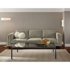 a living room scene with focus on the couch and coffee table