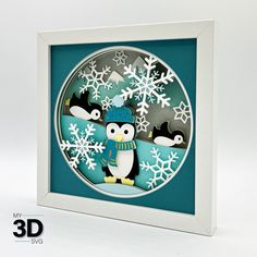 an ornament with penguins and snowflakes in the shape of a circle