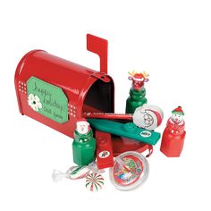 a red mailbox with christmas decorations and candy on the outside, including santa's helper