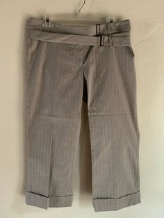 Item Details NEW $206 Tom K Nguyen Seashell Cropped Wide Leg Pants US Women's Size 10 Light gray with darker micro stripes in a dot pattern.  Cropped wide cuffed legs.  Smooth cotton + silk blend material. Zip fly with hidden button closure. Adjustable double belt design at waist. Brand new with tags. Made in USA. Retails $206. Material: 84% cotton, 16% silk All of my items are guaranteed 100% AUTHENTIC or your money back. Spring Pinstripe Straight Leg Pants, Spring Pinstripe Business Casual Pants, Pinstripe Bottoms For Spring Workwear, Striped Bottoms For Business Casual Fall Season, Spring Pinstripe Bottoms For Workwear, Fall Season Striped Bottoms For Business Casual, Spring Pinstripe Ankle-length Pants, Spring Pinstripe Workwear Pants, Pinstripe Office Bottoms With Belt Loops