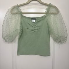 Super Cute Crop Top In Mint Green Or Pistachio. The Sleeves Are Puffy And Sheer. Super Cute For Summer/Spring! Green Puff Sleeve Top For Party, Green Puff Sleeve Top With Short Sleeves For Spring, Trendy Green Puff Sleeve Top For Spring, Green Puff Sleeve Tops For Spring, Green Fitted Puff Sleeve Top For Spring, Fitted Green Puff Sleeve Top For Spring, Cute Fitted Green Blouse, Cute Green Spring Blouse, Mint Green Crop Top