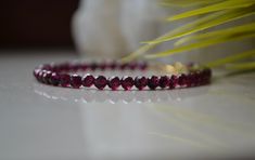 "This Delicate gemstone bracelet is made of Genuine Garnet with Gold vermeil clasp. This bracelet will be a perfect gift for a person who born in January - Garnet is a January birthstone. Garnet beads used in this bracelet are AAA Quality. Garnet works to balance the mind and emotions by helping you discard outdated ways of thinking and giving way to a new path of abundance and vitality. This delicate crystal bracelet is perfect for itself or is simple enough that it can be layered with other br Elegant Ruby Gemstone Beads Bracelets, Elegant Ruby Beaded Bracelets With Gemstones, Elegant Ruby Gemstone Beaded Bracelets, Elegant Burgundy Bracelets As Gifts, Red Faceted Elegant Bracelets, Elegant Red Faceted Beaded Bracelets, Elegant Red Faceted Bracelets, Elegant Red Crystal Bracelet With Gemstone Beads, Red Gemstone Jewelry