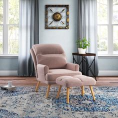 a living room with a chair and ottoman