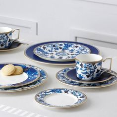 blue and white plates with cookies on them