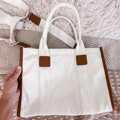 White Canvas Handbag With Crossbody Strap Brand New Chic White Canvas Bag For Travel, Chic White Canvas Travel Bag, White Cotton Shoulder Bag With Adjustable Strap, Trendy White Crossbody Canvas Bag, White Satchel Bag For Day Out, Chic White Canvas Bag For Daily Use, White Crossbody Shoulder Bag For Day Out, Casual White Shoulder Bag For Day Out, Trendy Cream Canvas Bag With Adjustable Strap