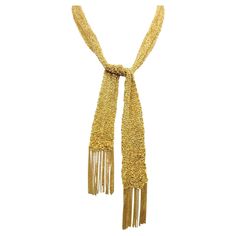 This exquisite 18 karat yellow gold mesh necklace is sure to become one of your new favorites. This versatile piece is unique, feminine and simply lovely. It can be dressed up or down and worn with just about anything- a perfect addition to your jewelry wardrobe. The chic, contemporary necklace is composed of finely knit 18 karat yellow gold mesh. Though delicate in construction, this piece makes a bold statement. The form is malleable and ergonomic in the way it drapes over the body's contours Gold Handwoven Necklace For Gift, Elegant Yellow Chain Necklace For Formal Events, Mesh Necklace, Jewelry Wardrobe, Contemporary Necklace, Scarf Necklace, Tie Scarf, Elsa Peretti, In Construction