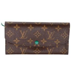 Louis Vuitton signature Monogram Emily Luxury Green Long Bifold Wallet Rouge with green detail leather & perfect for daily use. This is a Forest Green Long Travel Wallet perfect for Leisure or Daily Use. Wallet is in condition with basic wear t is some scuffs on the bottom corners and some leather creases from daily use the hardware has some discoloration. Item Specs: Made in Spain Date Code: CA0162 Measurements: 8"L x 1"W x 4"H Color: Brown Type: Wallet Please note that most items that we carry Monogram Canvas Wallets With Card Slots, Designer Green Wallet For Daily Use, Luxury Green Bags With Card Slots, Formal Green Bags With Card Slots, Designer Green Bags With Card Slots, Designer Green Bag With Card Slots, Designer Envelope Wallet For Travel, Designer Travel Envelope Wallet, Designer Travel Wallet In Envelope Shape