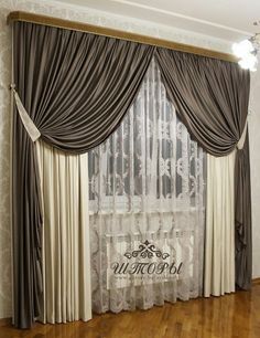 a living room with wooden floors and curtains