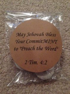 a round wooden plaque with the words may jehoah bess your commitent to reach the word 2 tim 4 2