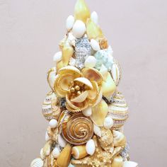 a christmas tree made out of shells and seashells