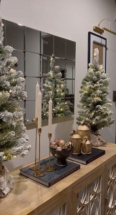 christmas trees and other decorations on a table