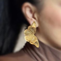 Glide into love with our luxurious Golden Butterfly Earrings, perfect for every beautiful change. Features: *Material: Bronze with gold plating. *Design: Delicate butterfly silhouette. *Finish: Exquisite golden shine that captures the light. These earrings symbolize grace and transformation, making them perfect for any who cherish beauty and growth. Discover the ultimate expression of affection. Make this an unforgettable gift or personal treasure. Shop now! Gold Butterfly Earrings For Formal Occasions, Gold Butterfly Earrings For Party, Gold Butterfly Earrings For Wedding, Gold Butterfly Metal Earrings, Plating Design, Butterfly Silhouette, Golden Butterfly, Delicate Butterfly, Design Silhouette