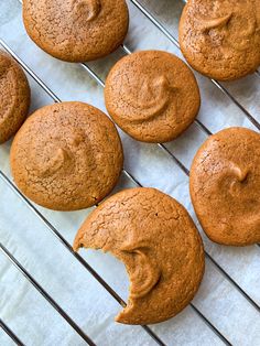 some muffins are cooling on a rack