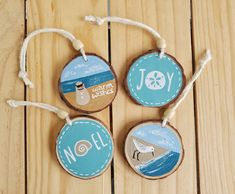 three wooden ornaments with the words joy, joy and joy written in blue on them