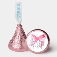 a herss candy bar with a pink bow on it and a white sticker