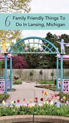 a colorful garden with flowers and people on it