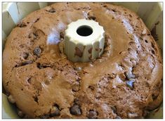 a chocolate cake with white frosting in a pan