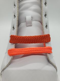 "Standard width orange shoelaces - a classic design that will make your shoes stand out.  Flat laces that are approximately 3/8\" wide. Many colors are available but if you don't see the combination you want feel free to reach out to us. Your shoes will look great with a new set of quality hand crafted shoelaces made one at a time on our antique braiding machines in St. Louis, MO, USA Add Metal Aglets - $2 per pair (Silver, Gold, Antique Brass, Black) Shoelace lengths vary because of styles and Orange Lace-up Sneakers With Elastic Laces, Orange Elastic Lace-up Sneakers, Trendy Orange Sneakers With Laces, Casual Non-slip White Shoe Accessories, Sporty Adjustable Lacing Sneakers, Casual Sneakers With Adjustable White Laces, Shoes Stand, High Top Boots, Shoe Insoles