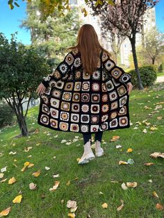 Crochet afghan granny square cardigan This black cotton jacket is a very stylish and great product for daily use. Also a great gift for your family and friends.🎁 📏Size of the cardigan in the photo: US size : 2-4-6-8-10-12-14-16-18 (S-M-L) 📏The length of the cardigan in the photo is 110-120cm (43-47inch). 📏Models height is 165 cm. Made of highest quality cotton, and anti allergic yarn. Wash Instructions: Machine washable at low temperatures. (30 C / 86 F)🫧. It takes around 7-14 days to prepare one handmade cardigan. We ship by FREE express shipping after your order is ready.🚀📦 Your tracking number will be provided to you as soon as after the shipment. Check out our shop for other models.👀 Please message us for orders with your own colour choice or measurements. We are happy to help Bohemian Black Outerwear With Patchwork, Bohemian Black Patchwork Outerwear, Black Bohemian Patchwork Outerwear, Black Long Sleeve Granny Square Cardigan, Black Bohemian Long Sleeve Sweater Coat, Black Long Sleeve Bohemian Sweater Coat, Black Granny Square Sweater For Fall, Bohemian Black Cardigan With Granny Square, Black Bohemian Cardigan With Granny Square Details