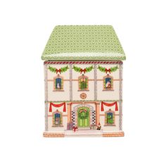 a toy house with a green roof and red trimmings on the front door