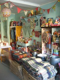 a room filled with lots of different items and decor on the walls, including baskets