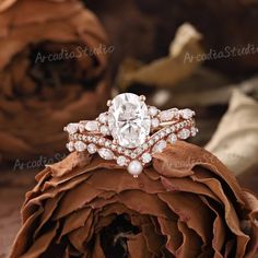 a close up of a ring on top of a flower