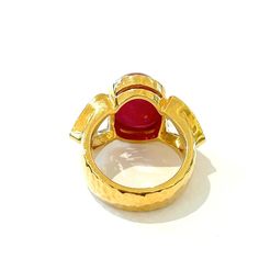 This is part of Chairish’s Fine Jewelry assortment.  Red natural ruby, Oval cabochon shape - 13 carats White natural topaz, 7 carats  This Ring is from the "Orient" traveling collection are the epitome of elegance and versatility. It offers a perfect blend of day to night and swimwear to evening wear, allowing you to effortlessly transition between different occasions and outfits. Wearing these spectacular oriental-style ring will undoubtedly make you the center of attention. It addw a touch of Luxury Ruby Ring Oval Cabochon Polished Finish, Luxury Ruby Ring With Cabochon Cut, Luxury Ruby Ring With Oval Cabochon And Polished Finish, Luxury Ruby Ring Oval Cabochon With Polished Finish, Luxury Ruby Oval Cabochon Ring, Luxury Ruby Ring Oval Cabochon, Luxury Cabochon Ruby Ring For Anniversary, Luxury Hallmarked Oval Cabochon Ruby Ring, Luxury Red Cabochon Ruby Ring