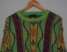 Up for sale stunning Vintage 1990s Bright Colour Knit sweatshirt Used sweatshirt, show sign of wear with 3 defects on back, Overall still in good vintage condition (Please refer picture) Size on label Medium with actual measurement taken when lying flat armpit 22.5 inches and 26 inches in total lenght (Approx) Please note that vintage sizing is not the same as modern sizing. Always go by the measurements we provide and compare them to an item that fits you well. Feel free to message me for measu 90s Style Fall Sweater For Streetwear, Green 90s Style Winter Sweater, Retro Crew Neck Sweater For Streetwear, 90s Style Cotton Sweater, Multicolor Crew Neck Sweater For Streetwear, Multicolor Sweater For Streetwear, 90s Style Green Crew Neck Sweater, Green Y2k Style Winter Sweater, 90s Style Green Long Sleeve Sweater