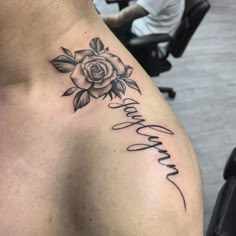 a man with a rose tattoo on his chest