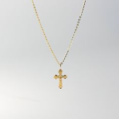 This is the perfect religious pendant to wear if you're looking for a crucifix necklace that shows nothing but Jesus and His act of love for the world. Neat and simple, you will be reminded of how Jesus Christ sacrificed His life for your sins. This 14K solid gold Catholic crucifix pendant will be a simple reminder for you or someone you love of Jesus and His unconditional love. Pair it with a fine gold chain and wear it close to your heart. The religious piece is 100% tarnish-free and will radi Dainty Crucifix Necklace With Adjustable Chain, Spiritual Cross Necklace With Adjustable Chain, Crucifix Cross Necklace With Clavicle Chain As Gift, Spiritual Cross Pendant For First Communion, Cross Pendant Charm Necklace With Adjustable Chain, Spiritual Cross Pendant Jewelry For First Communion, Engraved Cross Necklace For First Communion, Cross Necklace With Adjustable Chain Crucifix As Gift, Yellow Gold Crucifix Necklace With Clavicle Chain