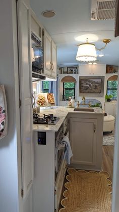 the kitchen is clean and ready to be used as a living room or dining area