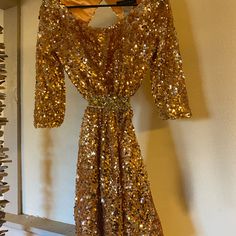 This Was My Senior Homecoming Dress And It Is Beautiful!!! It Was Pretty Expensive And I Only Wore It The One Time To The Dance. Open Back! No Flaws Size 4 Comment Any Questions. Gold Sequin Midi Dress For Formal Occasions, Formal Gold Sequin Midi Dress, Festive Gold Midi Dress For Evening, Gold Festive Evening Dress, Gold Knee-length Party Dress, Gold Knee-length Dress For Party Season, Gold Cocktail Dress For Holidays, Dressy Gold Sequin Dress, Gold Long Sleeve Mini Dress For Wedding