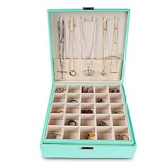 an open jewelry box filled with lots of necklaces