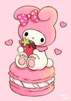 a hello kitty sitting on top of a pink cupcake with a strawberry in it