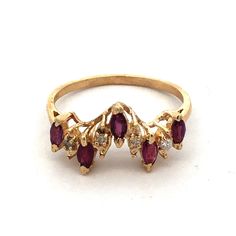 * Estate 14k Yellow Gold Marquise Amethyst Diamond Stacking Band Ring * Ring Size: 7.25 * Band Width: 1.5 Mm * Top Of Ring Measures: 3/4" X 3/8" * Height: 1/4" * Weight: 2..1 Tgw * 5 Marquise Amethyst Measure Approximately 3.6 Mm X 2.2 Mm Each * 4 Round Diamonds Measure Approximately 1 Mm Each * Ring Can Be Resized For An Additional Fee. * 2 Matching Stackable Rings Sold Seperately. * Marked: 14k * Condition: As Pictured. * G4467 Yellow Gold Marquise Multi-stone Jewelry, 14k Yellow Gold Ruby Ring With Gemstone Accents, Anniversary Yellow Gold Ruby Ring With Gemstone Accents, Yellow Gold 14k Stamped Amethyst Ring, Diamond Stacking Band, Stacked Diamond Bands, Stacking Bands, Ring Ring, Ring Size 7