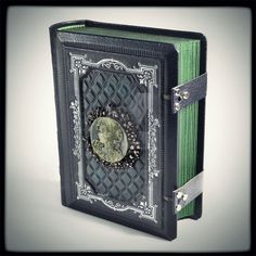 an open book with a decorative cover