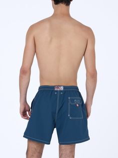 Introducing our Patmos swim shorts, crafted from textured polyester fabric, offering a cotton-like touch. Enhanced with contrast stitching and drawstring, as well as the embroidered exclusive Saint Barth logo detail at the bottom leg. Features a back pocket with flap and velcro closure. This version is made from fast-drying seersucker fabric with a vertical pinstripe pattern. Man Patmos mid-length swim shortsFast dry seersucker fabricSky blue plain colorExclusive Saint Barth logo detail at the bottom legComfortable elasticized waistbandAdjustable drawcord with branded terminalsInner mesh liningSide pockets with French seamsBack patch pocket with velcro closureBranded eyelets designed to drain water and prevent ballooning effectMC2 Saint Barth exclusive label on the backClassic fitCompositi Pinstripe Pattern, Seersucker Fabric, Print Swimwear, Saint Barth, Printed Swim, Man Swimming, Summer Hats, Beach Dresses, Style Icon