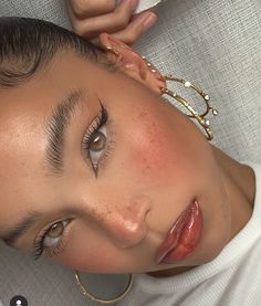 a close up of a woman with freckles on her face