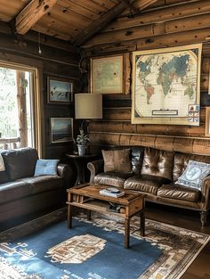 a living room filled with furniture and a large map hanging on the wall above it