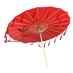 an open red umbrella with birds on it's sides and fringes attached to the handle