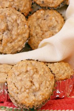 some muffins sitting on top of a red cloth