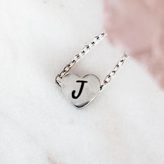 Discover our exquisite collection featuring custom stainless steel mini heart necklace with personalized initial, perfect for creating a unique and meaningful custom gift.  Minimalist delicate customized gift for mom, best friend, or special someone.   How to Order: ❣️ 1.  Choose Silver or Gold 2.  Choose Custom Engraving or NO Engraving 3.  Add to Cart 4.  Add Initial Desired and Font Choice to Personalization Box or N/A if not applicable 5.  Check out Material: 🌿 Waterproof, non-tarnish, hypo Dainty Silver Heart Pendant Initial Necklace, Dainty Silver Initial Necklace For Valentine's Day, Personalized Stainless Steel Heart Necklace, Personalized Minimalist Stainless Steel Jewelry, Minimalist Personalized Stainless Steel Jewelry, Personalized Dainty Heart Pendant Charm Necklace, Personalized Heart Pendant Initial Necklace For Everyday, Personalized Dainty Stainless Steel Necklaces, Dainty Personalized Heart Necklace With Initial Pendant