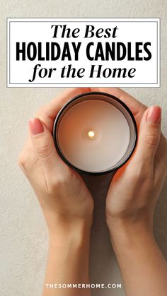 someone holding a candle in their hands with the text, the best holiday candles for the home