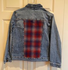 "This is an upcycled denim jean jacket to which a plaid,  wool panel has been added on the back. I was inspired to make these jackets after seeing similar ones in a store where they were costing considerably more. The jacket is marked (L) and it's measurements are as follows:  Armpit to armpit 17\", sleeve 21\", and length 21\".  The jacket was laundered prior to the addition of the wool panel.  I would suggest spot cleaning or dry cleaning as needed in the future. It's a very versatile jacket a Plaid Cotton Outerwear With Patchwork, Plaid Denim Outerwear With Pockets, Plaid Denim Outerwear For Fall, Reworked Denim Outerwear For Fall, Reworked Medium Wash Denim Jacket For Fall, Fall Reworked Medium Wash Denim Jacket, Casual Reworked Denim Jacket For Winter, Upcycled Clothing Ideas, Versatile Jacket