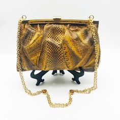 "Vintage Python Handbag Purse Circa 1970s Patchwork Snakeskin Leather Shoulder Bag Gold Tone Metal Frame & Secure Clasp Gold Metal Chain Link Shoulder Strap with amber Rhinestone Stations Suede Lining Inner Zip Up Pocket Exotic Late 20th Century Fashion Accessory In good vintage condition NB: There is minor fading of the gold gilt on the metal frame. Moderate indications of age & use internally Jewelled Stations missing one or two rhinestones bag approx: 9\" (22.5cm) wide x 6\" (15.5cm) tall  Ch Python Handbags, Snake Skin Handbag, 20th Century Fashion, Retro Mode, Metal Chain Link, Leather Purse, Metal Chain, Gold Tone Metal, Chain Strap