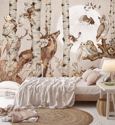 the wallpaper in this bedroom is decorated with owls, deer and other wildlifes